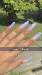 The nails are all light purple but three are covered in glitter and the other two have a beautiful rhinestone design. Light Purple Long Length Coffin Shape Gel Nail Lilac Colour Caviar Beads Ombre Acrylic Nails Beautiful Nails Purple Nails