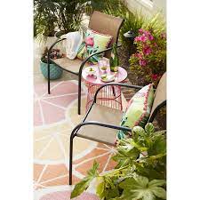 garden treasures pelham bay stackable black metal frame stationary dining chair s with tan sling seat lowes com in 2021 outdoor sling chair outdoor decor backyard dining chairs