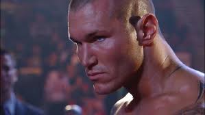 Kofi Kingston defaces Randy Ortons gift.