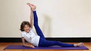 Raise your hands above your head, bend forward, and touch your toes; Meet Oldest Yoga Instructor In The World 98 Yr Old Says Secret To Vitality Is Yoga And Wine Inspiremore
