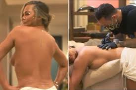 Chrissy teigen has made it no secret she has no problem giving fans glimpses into her life, and her transparency is one of the main. Chrissy Teigen Gets Sexy Back Tattoo Tribute To Her Husband John Legend Mirror Online