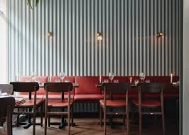 Finnish Designer Joanna Laajisto Combined Mint Coloured Corrugated Metal Wall Panels With Red O Metal Wall Panel Restaurant Interior Design Restaurant Interior