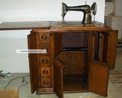 Once production settled down into the model 27 and 28 versions, singer produced many variants that were intended for different cabinets and power sources. Singer Sewing Machine In Wooden Cabinet Cabinet
