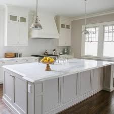 White kitchen island open to living room, brass lantern fixtures, brass cabinet hardware, pretty rubber, quartz counters, wood beams #kitchendesign boyse residence. Kitchen Design Decor Photos Pictures Ideas Inspiration Paint Colors And Remodel Page 5 Kitchen Design Grey Kitchens White Marble Countertops
