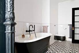 An otherwise all white bathroom pops with a dramatic dark tile floor and vice versa. 25 Creative Geometric Tile Ideas That Bring Excitement To Your Home