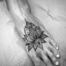 Wear a short dress and show off the lotus and leaf tattoo behind your knee. Mandala Lotus Flower On Foot By Clara Welsh Mandala Foot Tattoo Foot Tattoos Lotus Tattoo Foot