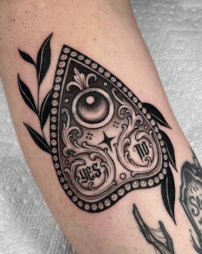 ouija planchette for courtney 👁️ thank you for making the time to get this done during your visit 🖤🖤 • #ouijatattoo #torontotattoo #blackworktattoo #torontotattooartist #darktattoo ornamentaltattoo gothictattoo blackworkers blxckink ...