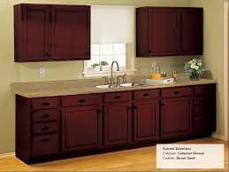The cabinet transformations is a cabinet coating paint and primer blend that is available in a variety of colors. Kitchen Ideas Rustoleum Cabinet Transformations Cabernet Glazed Counter Desert Sand Brushed Nickel Hardware Kitchen Remodel Rustoleum Cabinet Kitchen