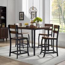 A rustic wooden table gives a different touch to this modern dining room with contemporary white chairs. Counter Height Rustic Kitchen Dining Room Sets You Ll Love In 2021 Wayfair