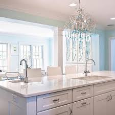 The island also features frosted glass doors for extra embellishment. Kitchen Island With 2 Sinks Design Ideas