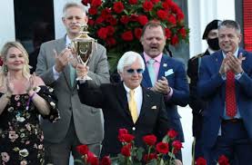 Trainer bob baffert, center in yellow tie, with medina spirit after winning the 2021 kentucky derby. Former Wildcat Bob Baffert Wins His 7th Kentucky Derby