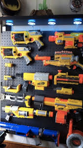 The rack has storage for most types of nerf guns, from pistols to rifles. Nerf Storage Ideas A Girl And A Glue Gun