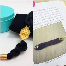 the bracelet is designed from the old omani ornaments with cotton threads اخذت فكرت السوار من شكل العقام الذي كانت ترتديه المراة drop earrings jewelry silver