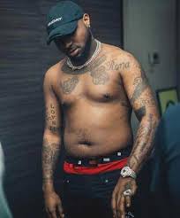 I find it disgusting cos 90% of them pisses me off why draw a dark tattoo no matter how much ink you invest on it on an already dark skin whats the beauty about it. Why Ladies Drool Over Davido Tattoo Photos