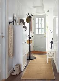 Made For Busy Exits And Warm Welcomes A Long Narrow Hallway With A White Shoe Cabinet With Space For 12 Pairs Hallway Designs Ikea Hallway Hallway Decorating
