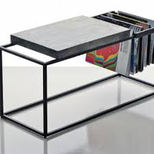 Featuring a rotating top to offer extra storage space to tuck away your coasts, board games and more. Magazine Storage 12 Tables And Stools That Can Help Organize Publications Core77