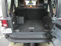Our subwoofer kits mount behind the rear seat and fasten to the floor using existing bolt holes. Jeep Wrangler Audio Upgrade Retains The Stock Look