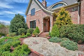 Pin By Tamera Thompson On Tudor Style Walkway Landscaping Tudor House Red Brick Exteriors