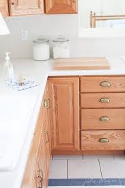 Making A Dated Kitchen Feel Fresh And Up To Date On A Budget Oak Cabinets Budget Kitchen Remodel Honey Oak Cabinets