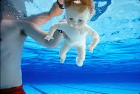 He was four months old when he was photographed for the lp, as his dad was friend of the photographer. Spencer Elden Kottke Org