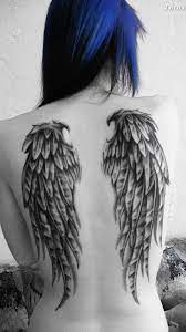 Tenley Tattoo Inkedarmor Clippedwings Helenahunting Tattoo Piercing Book Tattoosforwomenunique Wing Tattoos On Back Wing Tattoo Tattoos