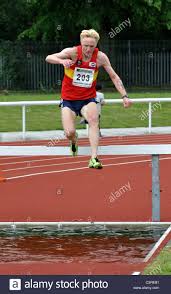 Competition in the 80th calvin houghland iroquois feature begins at 4. Runner In Veteran Men S Steeplechase Race Stock Photo Alamy