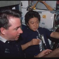 U.S. Navy Lt. Cmdr. David Bacon, center, and Lt. Joseph