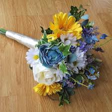 If you need pointing in the right direction or want to know how we manufacture bespoke bridal flowers and wedding bouquets, then we welcome you to contact us on +44 (0) 1664 778 045. Silk Wildflower Yellow Blue Brides Bouquet Artificial Wedding Flowers
