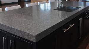 This light grey granite boasts grey scattered flecks with burgundy spots throughout its surface. Colors Sensa By Cosentino Graphite Grey Granite Countertops Price Granite Countertops Grey Granite Countertops