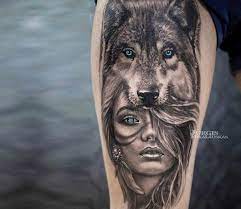 Pretty 2 Colors Realistic Tattoo Style Of Wild Girl With Blue Eyes Done By Tattoo Artist Jurgis Mikal Wolf Tattoo Sleeve Indian Girl Tattoos Wolf Girl Tattoos