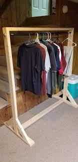 We needed a clothe rack for our yard sale. 2x4 Clothes Rack Clothes Shelves Clothing Rack Diy Clothes Rack