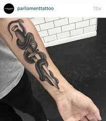Get all your favorite things on your thigh with a perfectly get this snake tattoo design with some geometrical designs in the background. Imagem De Knife Snake And Tattoo Snake Tattoo Knife Tattoo Tattoos