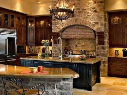 By san luis kitchen co. The Stone Wall In This Rustic Kitchen Is Highlighted By Salvaged Wood Beams And Old World Kitchens Rustic Kitchen House Design