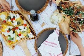 Pizza may be the perfect dinner party main dish because it is adaptable and fun. A Tuscan Dinner Party With Camille Styles La Crema