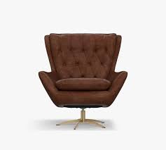 The bird and branch are black and gray set against a white background for a contrast that starts conversations. Wells Tufted Leather Swivel Armchair Pottery Barn