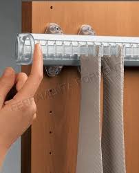 The rack pulls out from the depths of the closet, allowing the owner to bring his collection forward for ease in selecting the perfect necktie. Sliding Tie Rack Servetto Self System Ssnbp161