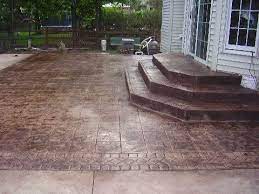 I was tired of having mud tracked through the house anytime the kids came through our unfinished side entryway. Concrete Stamped And Stained Makes Me Think That My Dream Home Will Be Fully Concrete Concrete Patio Patio Steps Stamped Concrete Patio