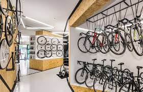 Mode Lina Designs Multi Functional Bike Shop For Velo7 Bicycle Enthusiasts Bike Room Design Bicycle Shop Bike Room