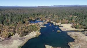 To the right is a large lava flow ending at the shore of big lake. Ahjumawi Lava Springs Youtube