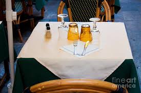 Getting a table setting right involves many thoughts, such as what to place in the central part of the table. Sidewalk Cafe Table Setting Photograph By Thomas Marchessault