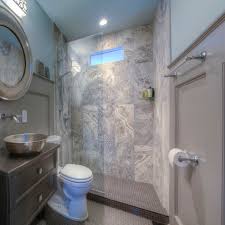 Install a shelf in the shower. 25 Professional Small Bathroom Design Tips