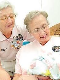 Volunteer cuddlers keep infants calm