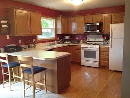 cherry wood kitchen cabinets with black
