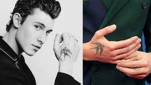 A guide to his ink and their meanings. Untold Stories And Meanings Behind Shawn Mendes Tattoos Complete Guide To All Of Shawn Mendes Tattoos Tattoo Me Now
