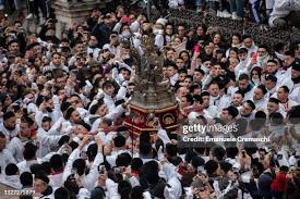The float containing the relics of Saint Agatha is surrounded by... News  Photo