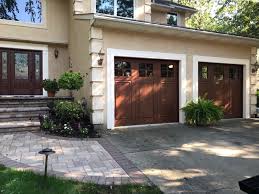 Traditional garage doors are the standard nowadays, but it doesn't mean you need to be stuck if you are looking for garage door alternatives to save money, then you likely won't want to buy a barn door. Faux Wood Garage Doors A Beautiful Alternative Artisan