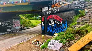 A woburn mural depicting george floyd, the black man whose death at the hands of police in minneapolis late last month has sparked national protests, has been defaced. George Floyd Mural On Pensacola S Graffiti Bridge Defaced Again Area Re Painted Wear