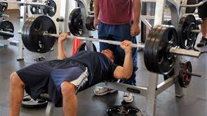 A standard barbell weighs 45 pounds, and you may begin by lifting only the bar. How Much Does A Bench Press Bar Weigh Two Rep Cave