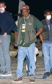 Check out our travis scott selection for the very best in unique or custom, handmade pieces from our shops. Travis Scott Dons Olive Green Vest And Light Wash Baggy Jeans As He Leaves Nobu Malibu With Friends Daily Mail Online