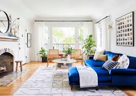 This condo living space showcases bold colors and geometric patterns that create a visually stunning design. Turns Out Velvet Is A Family Pet Friendly Design Secret Weapon 60 Shoppable Picks Emily Henderson